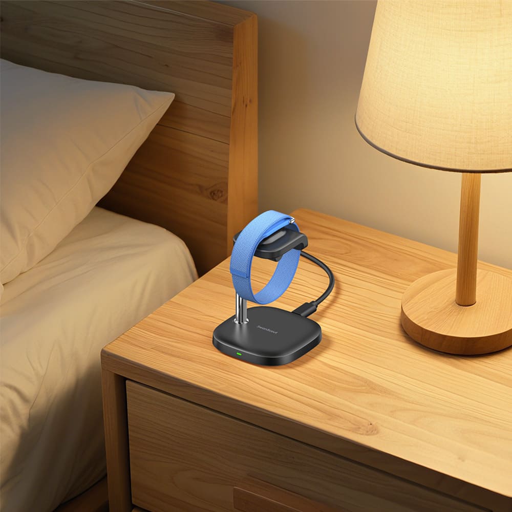 Fitbit Air charging on a bedside fitbit charger wireless charging station for overnight power with SwanScout S10034FA
